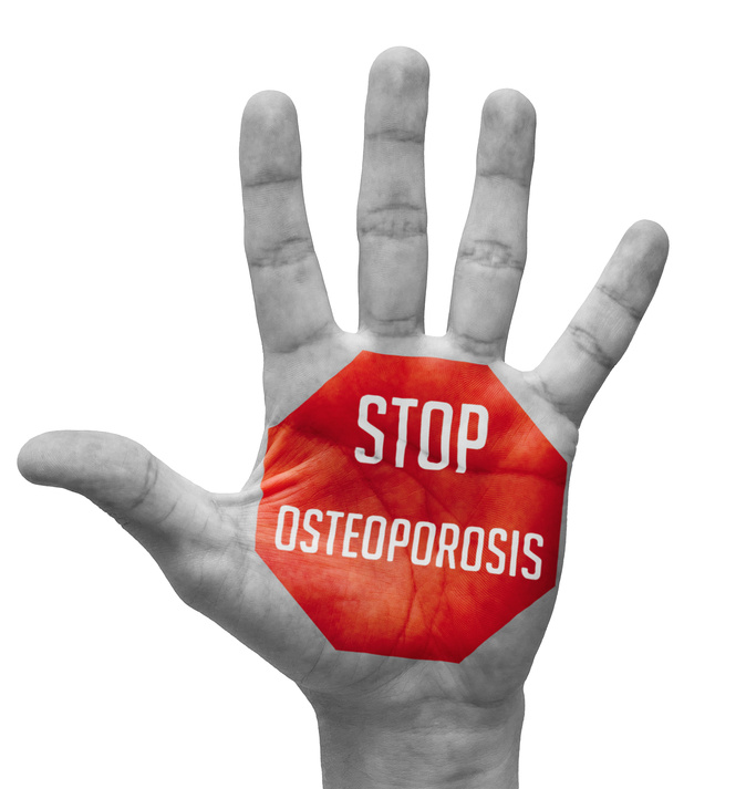 Stop Osteoporosis Sign in Red Polygon on Pale Bare Hand. Isolated on White Background.
